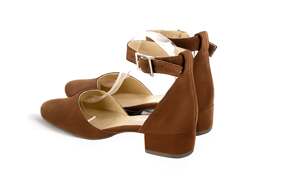 Women's caramel brown open side dress shoes, with a strap around the ankle. Round toe. Low block heels - Rear view